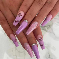Long ballet-style gradient ombre butterfly nails with 3D diamond accents—shimmering nail tips for instant, wear-anywhere manicures and easy-to-apply false nails.