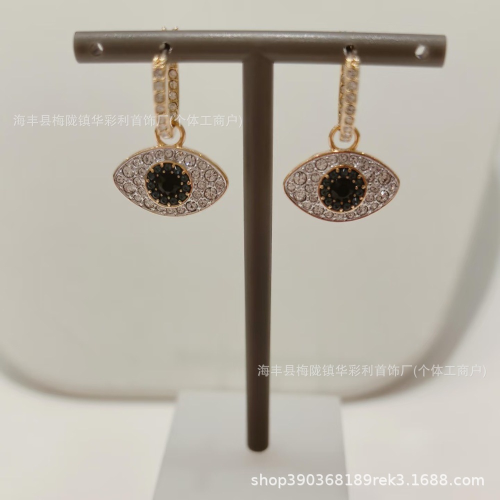 Gold devil eye earrings 5692163
