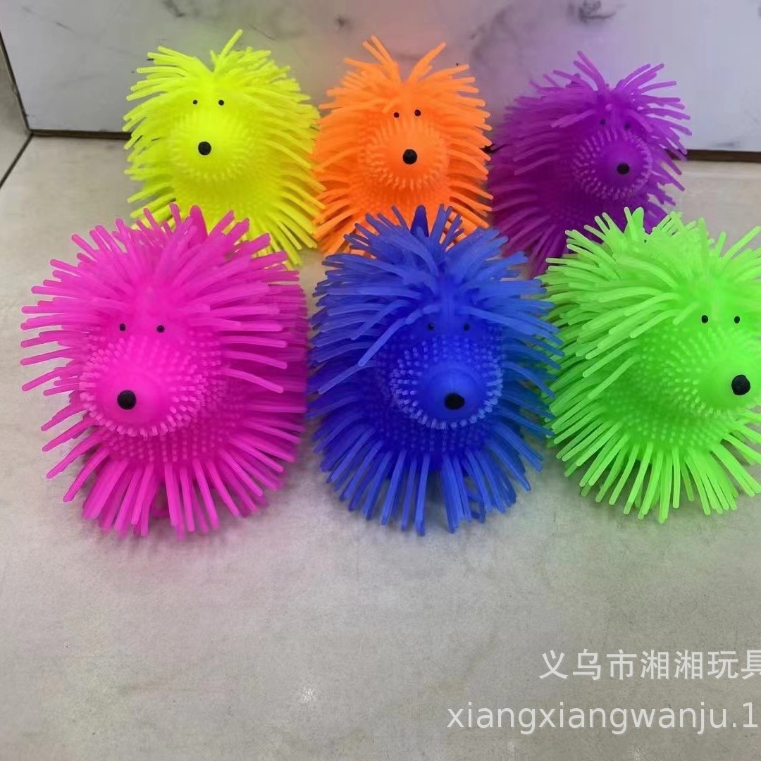 Conejo parpadeante bola de pelo TPR lindos perros peludos brillantes bola de pelo juguetes de ventilación juguetes calientes