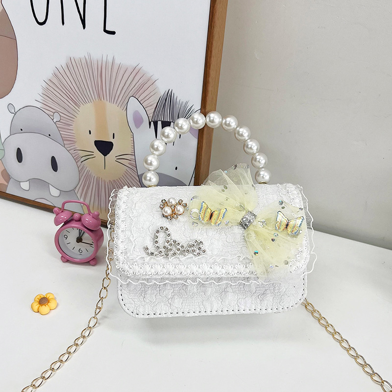 2023 nuevos niños bolsa de mensajero bolsa de moda princesa arco bolso de hombro coreano mini bolso de la cadena de la muchacha