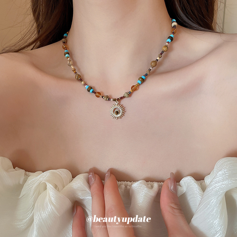 Acero de titanio piedra natural cuentas de arroz flor de sol collar con cuentas nueva cadena de clavícula retro china decoración de lujo ligero de alta gama mujeres