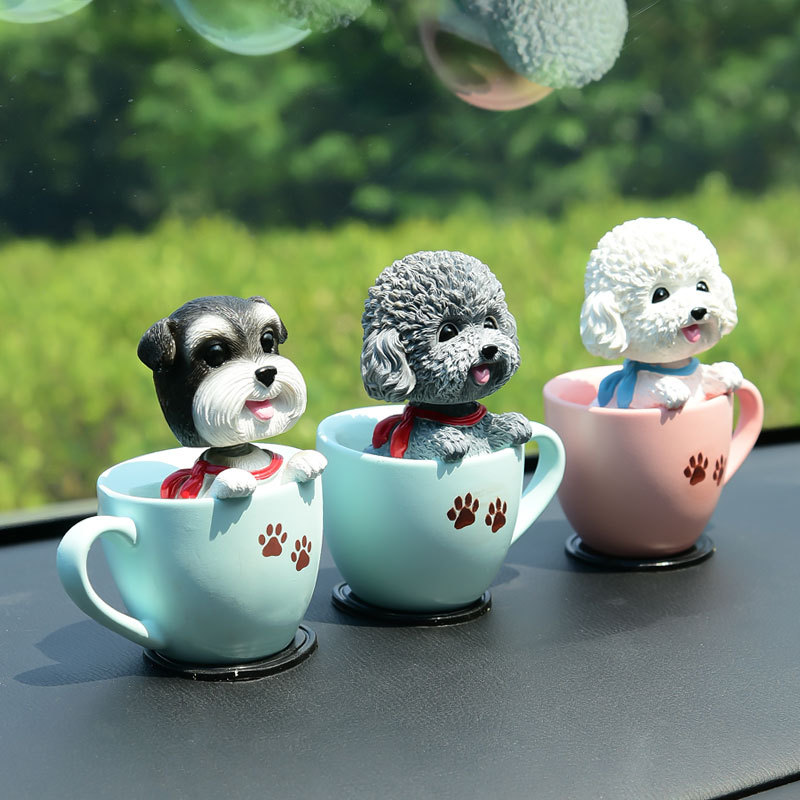 Creative car aromatherapy decoration cartoon shaking head tea cup dog carton Teddy chenari car decoration central control doll