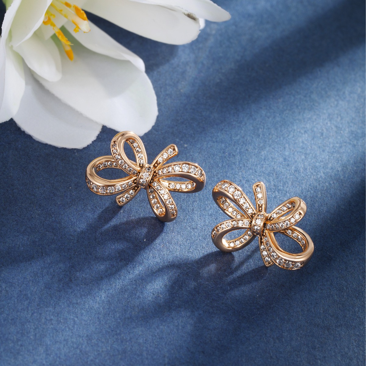 Joyería Xuping arco de bronce de piedra arco pernos de orejas de lujo nicho ligero japonés y coreano aretes dulces mujeres