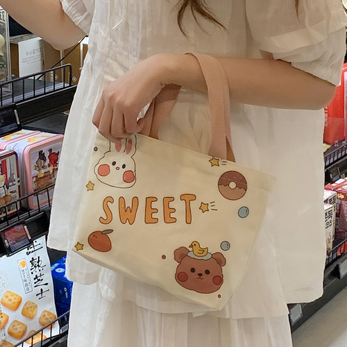 Canvas bag, women's hand-held lunch bag, cartoon bag, small hand-held bag, manufacturer wholesale, versatile, literary student bag