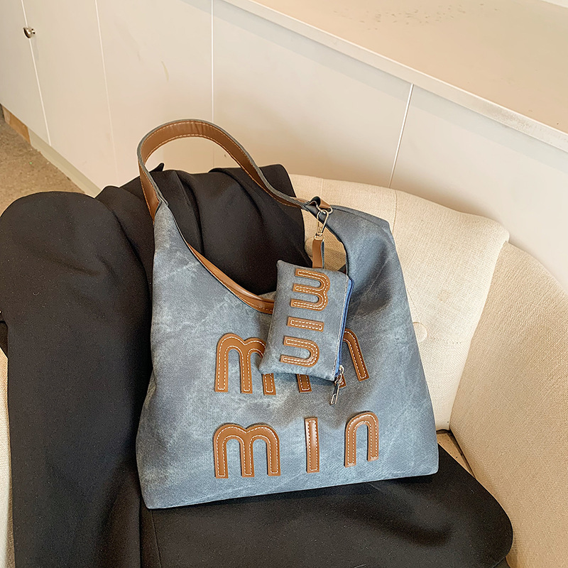 Alta sensación retro de gran capacidad 2024 nuevo estilo coreano bolso de mano de mujer de hombro de moda de viaje bolso de brazo