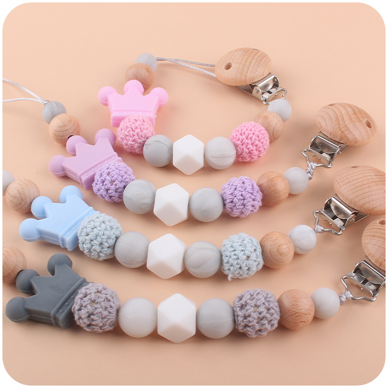 Suministros para bebés calmante clip de chupete de haya bebé anti-caída de la cadena de dibujos animados corona de silicona perlas mordedura molar chupete cadena