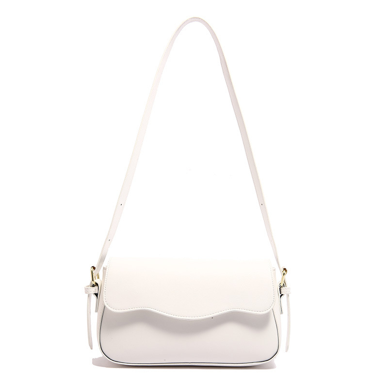 Bolsa de hombro de temperamento para mujeres 2024 otoño nuevo estilo de moda textura mochila de diseño artístico simple bolso de brazo