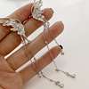 Metal ear clips with tassels, long earrings