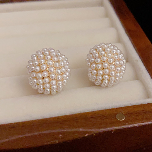 The same stylish and elegant pearl hoop earrings with a unique design, fashionable, cute, and a high-end vibe.