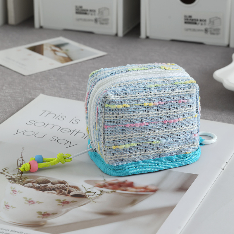 Nuevo mini bolso de llaves de viento de fragancia bolso de cambio lápiz labial de almacenamiento universal para el corazón de la niña conveniente para salir y almacenar en uno