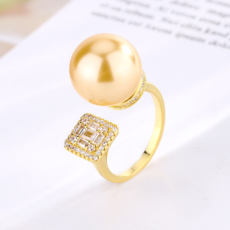 2024 nuevo estilo joyería cobre chapado en platino moda europea y americana con incrustaciones de perlas anillo ajustable mujer 14mm al por mayor