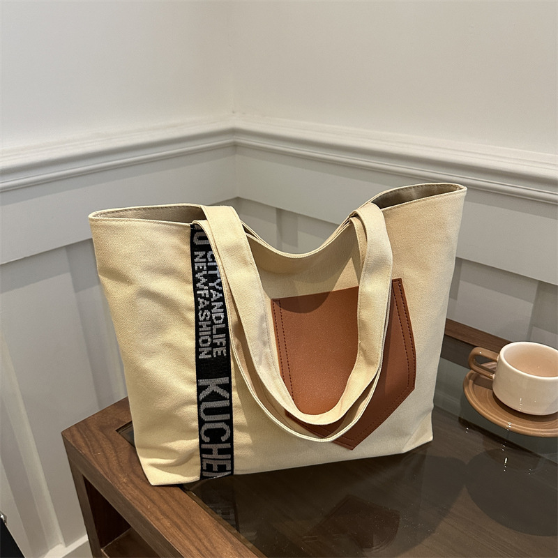 Bolso de mujer 2024 invierno nuevo bolso de gran capacidad de transporte de lona bolso de brazo de moda simple bolso de hombro