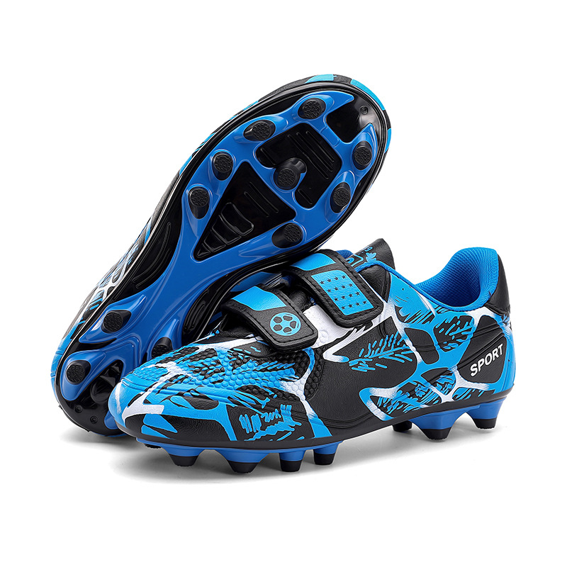 Niños y niñas transfronterizos transpirables cómodos deportes ociosos bajos clavos de clavos de hierba competición zapatos de fútbol de fábrica para niños
