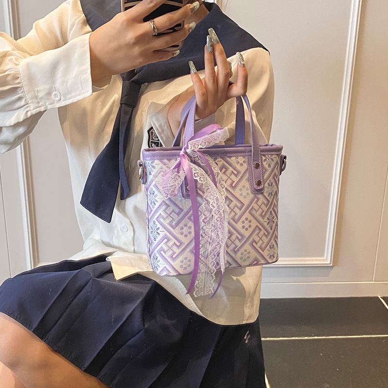 Bolso de cubo de agua súper fuego popular de verano para damas 2025 nuevo bolso de mano de tendencia salvaje bolso de mensajero de estilo nacional de sentido avanzado