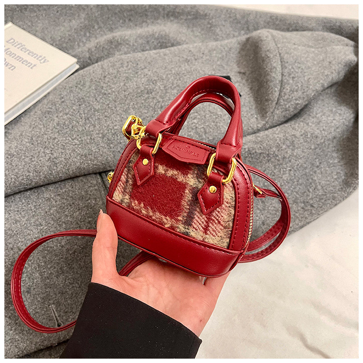 Mochila de moda de leopardo para niñas, mini bolso de concha portátil para bebés, 2025 nuevo bolso de comercio exterior para niños