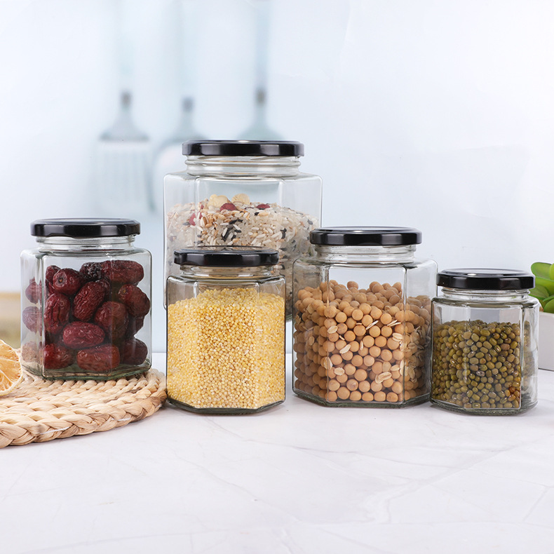 Botella de vidrio hexagonal espesada botella de miel sellada con tapa de crema de limón enlatado de salsa de Chile botella fábrica al por mayor