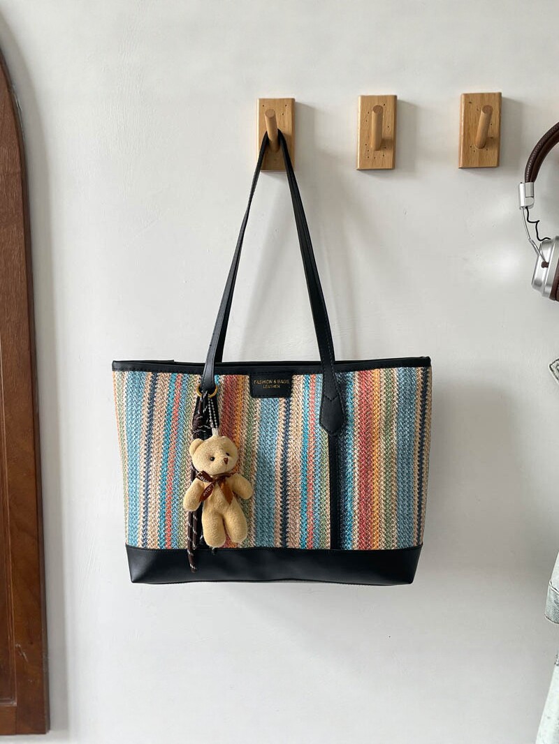 2026 nueva bolsa de tejido de gran capacidad de viaje mochila de hombro universal bolso coreano osos colgante moda