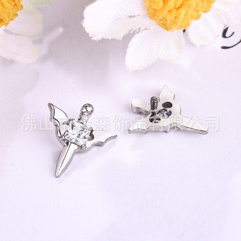 Silver pointed spike labret stud material detail
