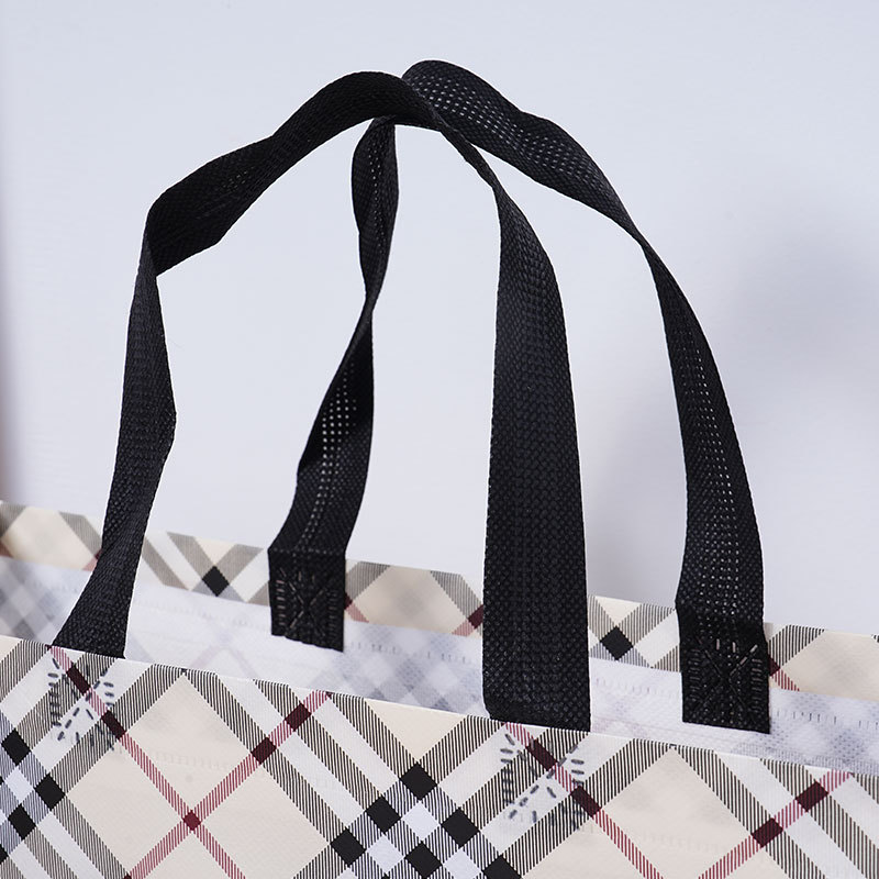 Bolsas de tela no tejida recubiertas de cuadrícula beige personalizadas atmósfera simple de alto valor de color bolsas de hombres y mujeres clásicas impermeables engrosadas