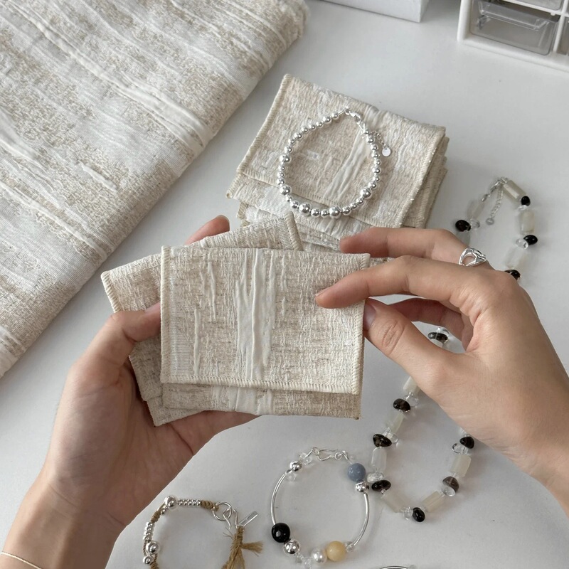 Factory New Cotton and Linen Textured Clothing and Jewelry Dustproof Simple High-End Jewelry Packaging Bag with Portable Flip Cover and Edge Binding