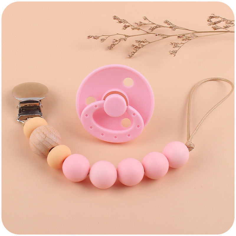 Nuevo bebé suministros chupete DIY creativo bebé silicona mordedura molar pezón cadena traje de dos piezas
