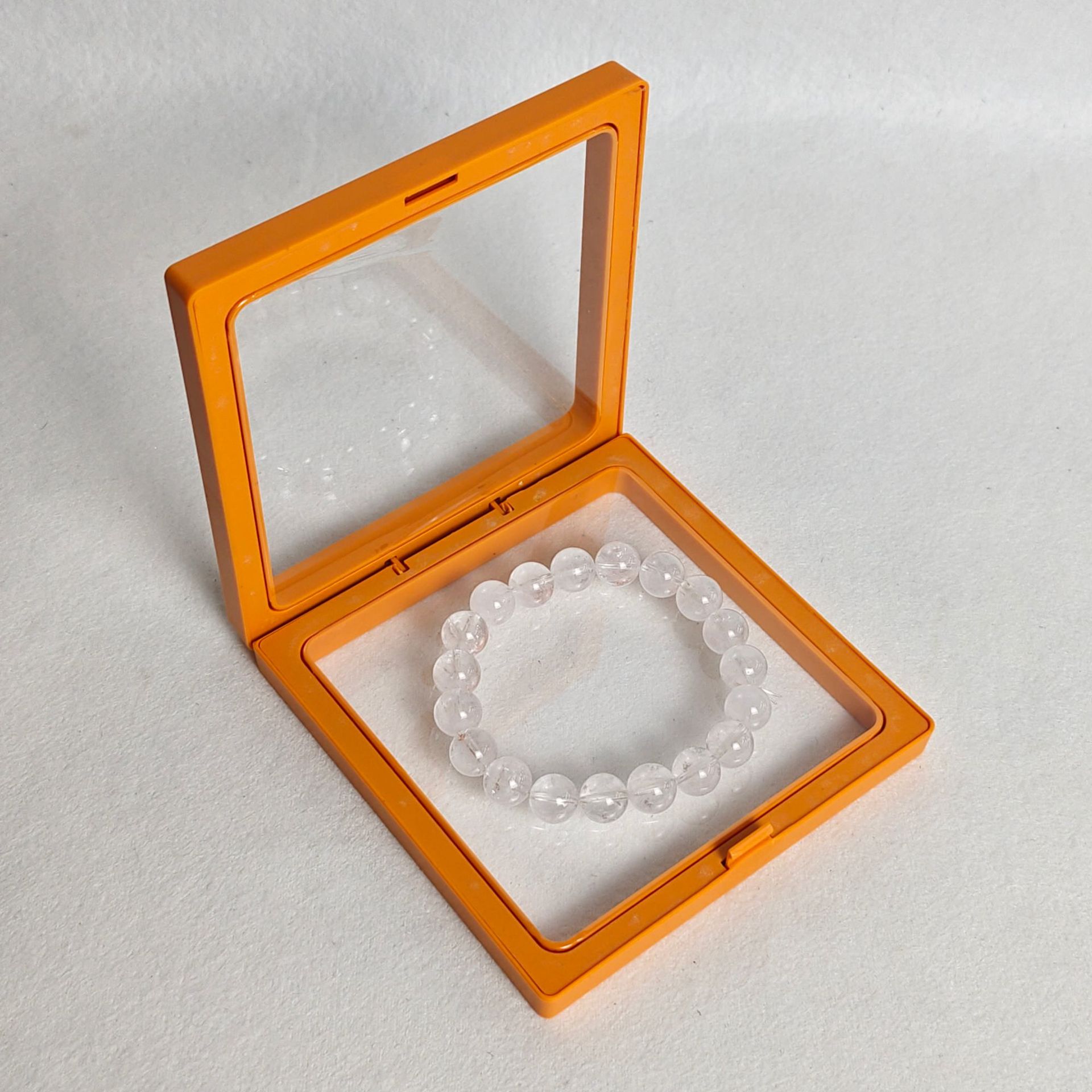 Orange pe film box; length and width 9*9cm, thickness 2cm