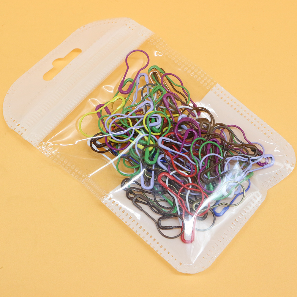 Factory-supplied metal safety pins for clothing and apparel—100 pieces per pack; wholesale toggle-style pin clasps and safety pins.