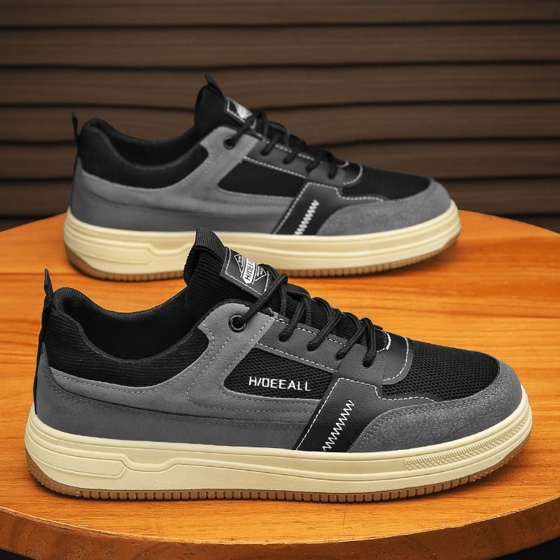 Zapatos de hombre invierno 2026 nuevo estilo ventilado puerto viento versátil anti-sucio zapatos de malla de moda ligero con suela suave zapatos deportivos casuales