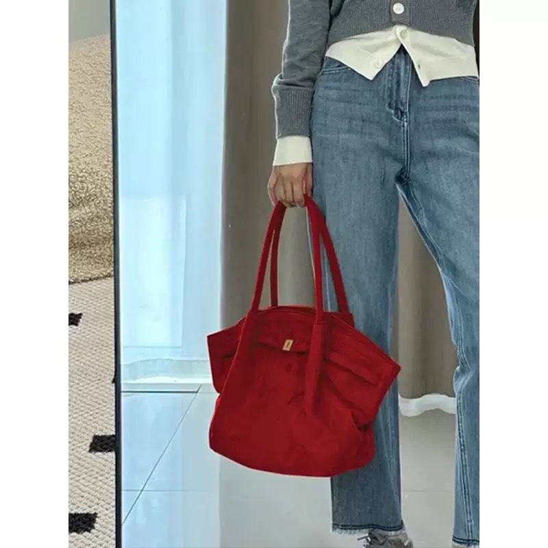 Bolsos de albóndigas de gran capacidad de muntjac rojo estilo femenino 2025 nuevo sentido de alta gama bolsos de bodas de novia de otoño e invierno