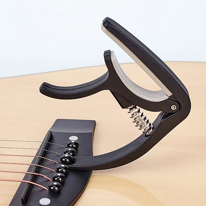 Guitar, universal nylon classic ukulele with a score