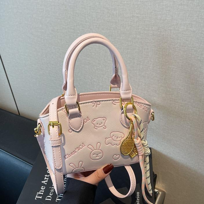 Tendencia nicho bolso de mano de moda mujer 2025 nueva textura versátil bolso de cubo bolso de transporte aéreo