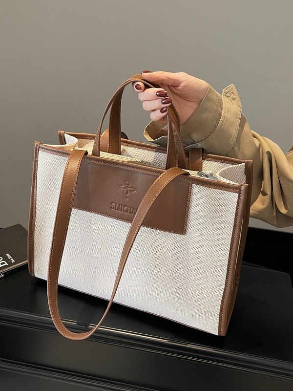 Bolsa de mano de lona de gran capacidad para mujeres caliente nueva moda simple alta textura mochila de viaje