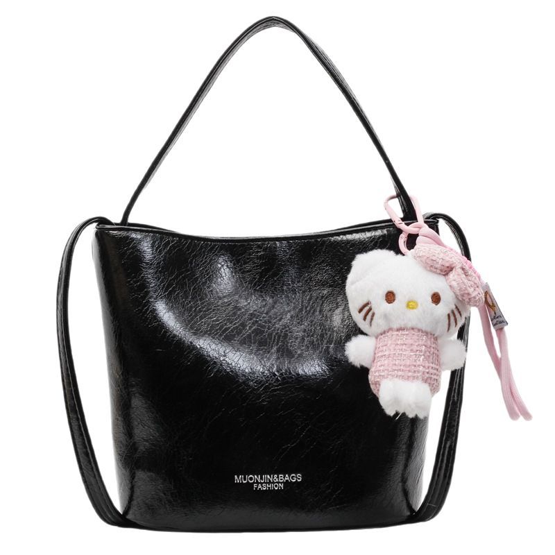 Bolso de cubo de viajero de gran capacidad simple de moda de moda para mujer 2025 nuevo bolso de mensajero de hombro casual de color sólido popular