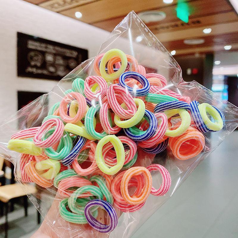 Banda de goma de bebé Corea del Sur banda de pelo de los niños anillo de toalla de color caramelo bolsa de Margarita banda de pelo OPP bolsa cuerda de pelo banda de goma al por mayor