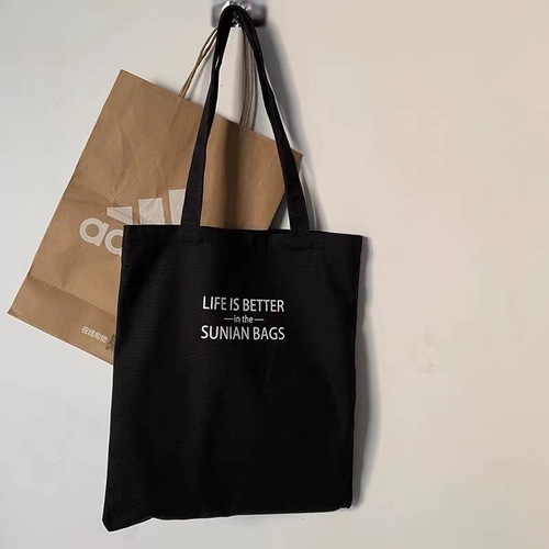 Large-capacity one-shoulder canvas bag with literary letters for male and female students attending class portable school bag Korean style niche design
