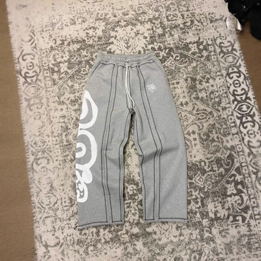 Pantalones de hombre de tendencia transfronteriza europea y americana nueva moda hip-hop street retro holgado casual estampado recto pantalones casuales