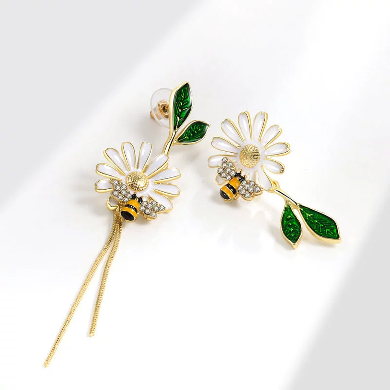 Design asymmetrical earrings, trend of season, flowered