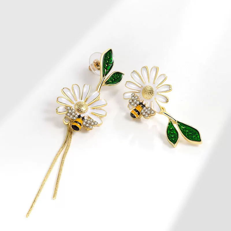 Design asymmetrical earrings, trend of season, flowered