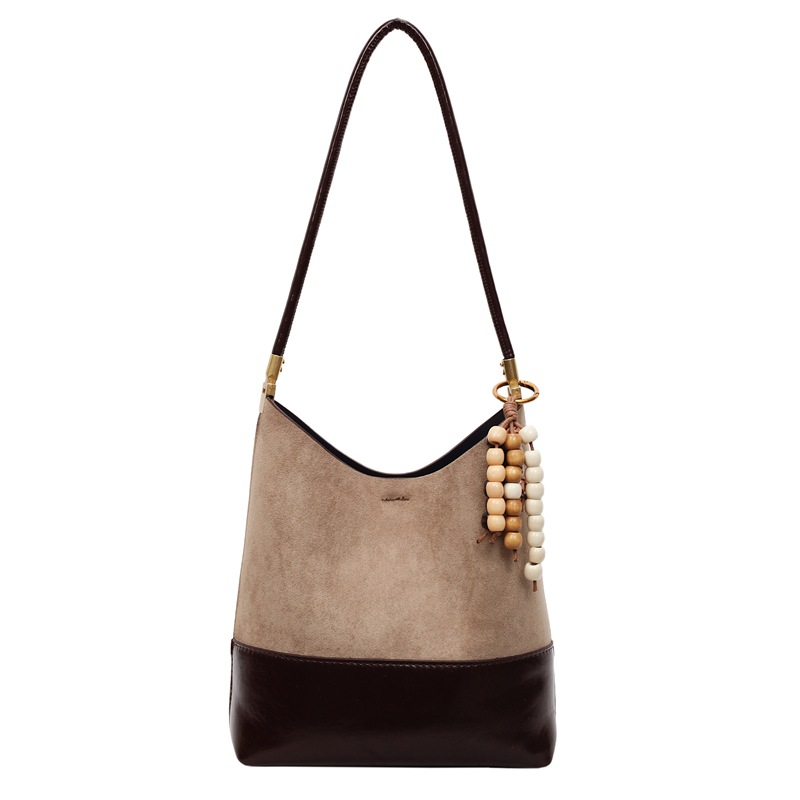 Bolsa de cubo de lujo ligera transfronteriza de gran capacidad para mujeres 2025, otoño y invierno, nueva bolsa de brazo universal, nicho, bolso de hombro de empalme