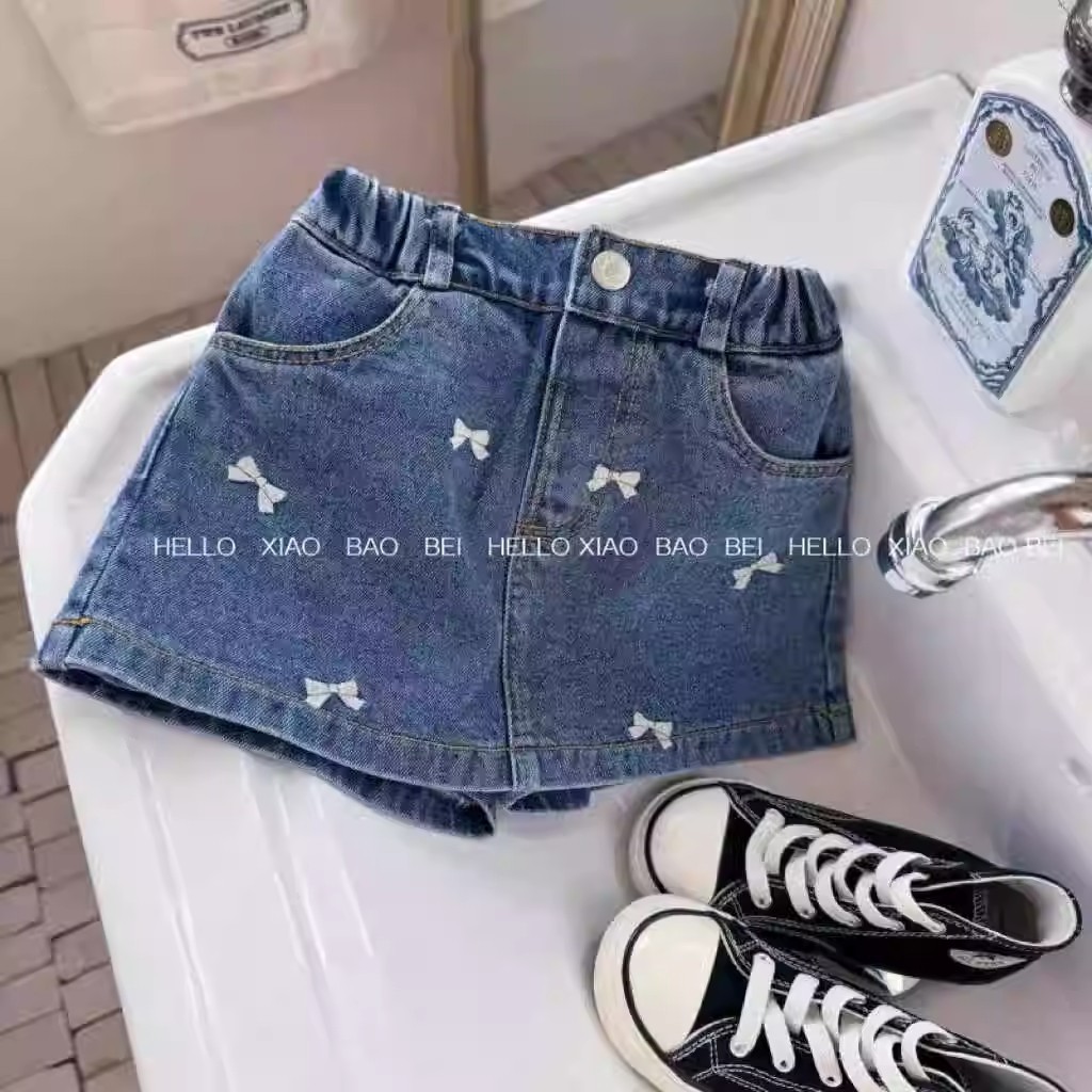 Qian Qi ropa infantil nueva falda de mitad de verano niñas bordadas con arco lavado con agua vaquero estilo extranjero A falda de mitad de mitad de mitad