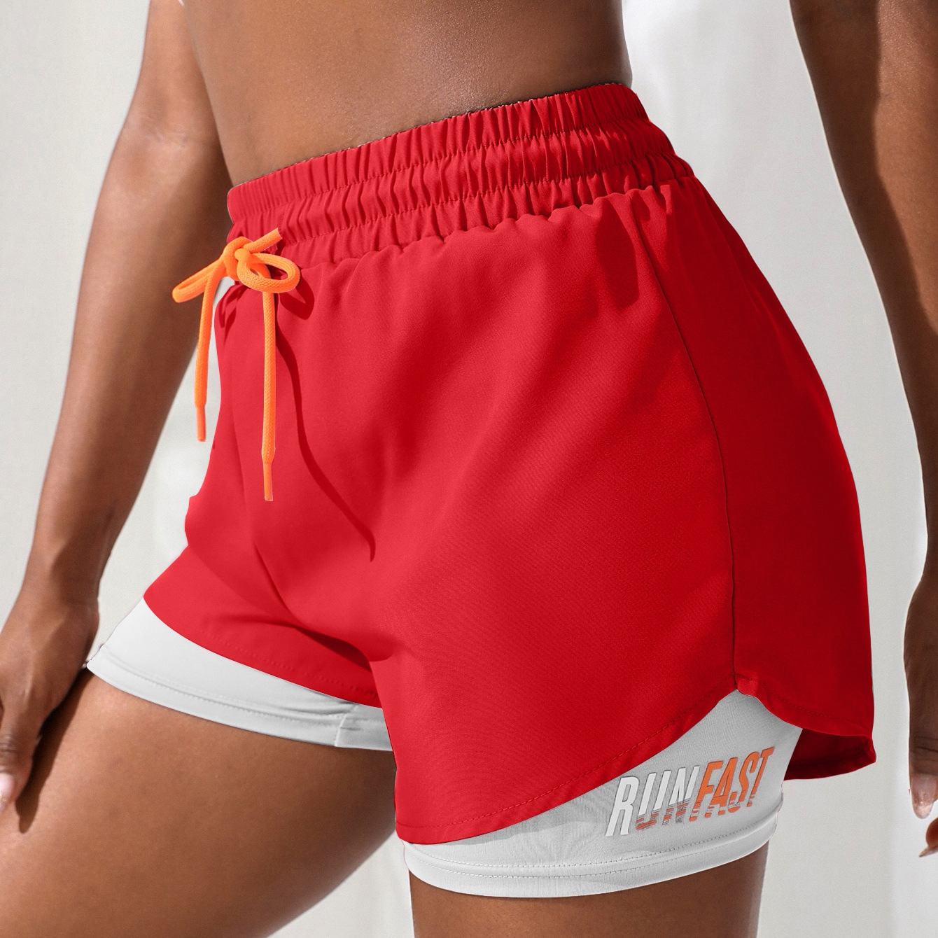 Pantalones cortos con cordón de color de contraste falsos de dos piezas pantalones cortos de tres letras deportivos casuales transpirables anti-exposición de las mujeres pantalones de yoga fitness