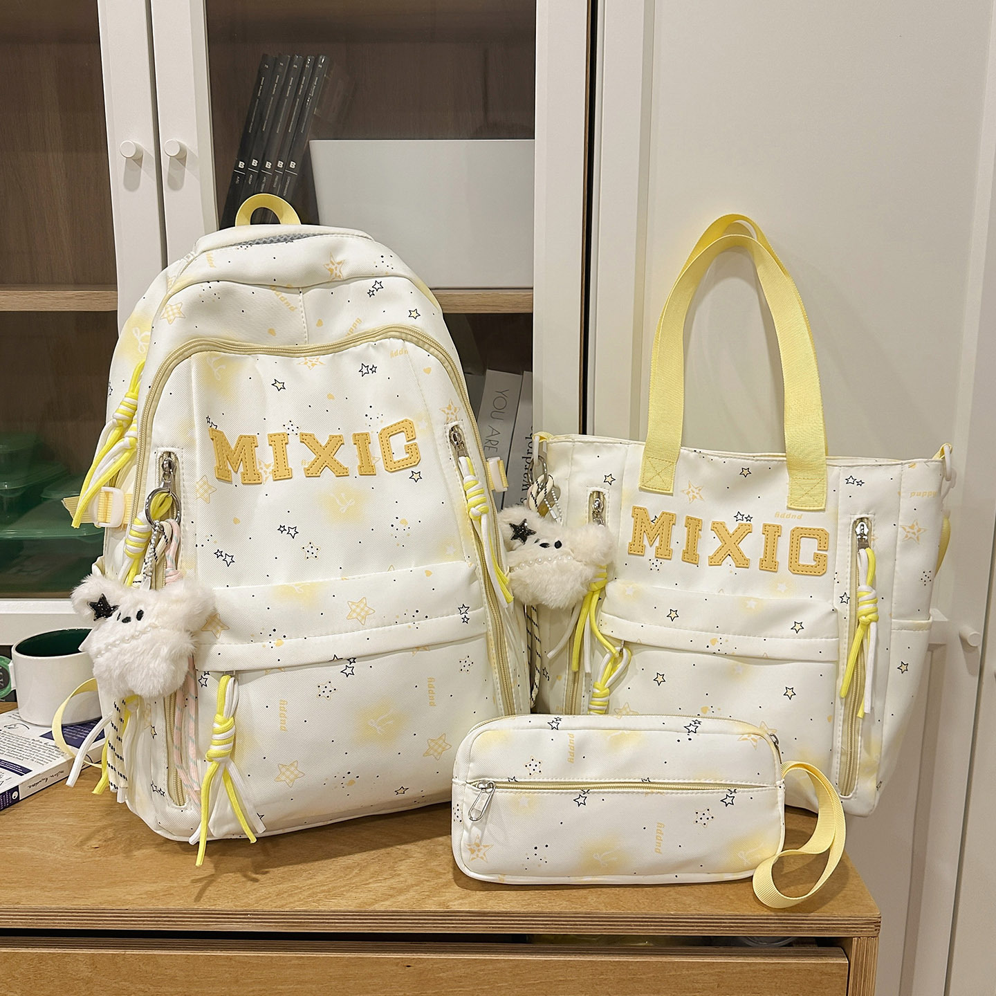 Yellow three-piece set with 2 black star and white fur rabbit ornaments