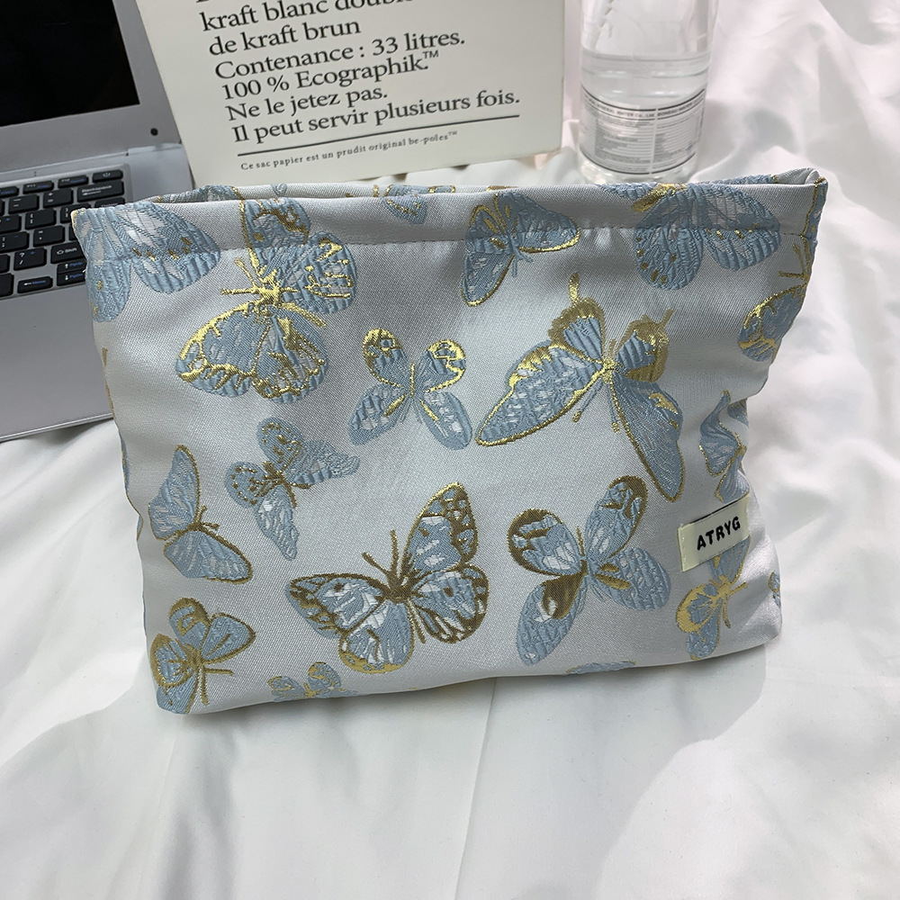 Bolsa de maquillaje de mariposa transfronteriza, bolsa de almacenamiento portátil para productos de cuidado de la piel, bolsa de lavado de viaje, bolsa cuadrada, bolsa de mano