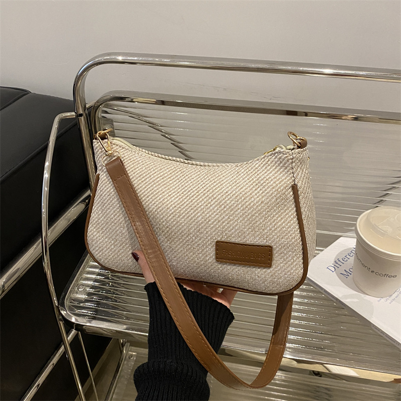 Elegante y simple temperamento nicho bolso de hombro casual 2025 primavera nuevo bolso de mochila de mujer versión coreana bolso popular
