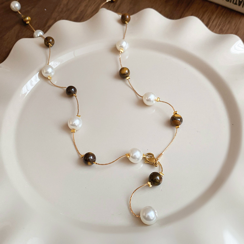 Collar de perlas de piedra de ojo de tigre artificial transfronterizo otoño e invierno cadena de suéter de todo fósforo de nicho accesorios de joyería de moda de alta gama