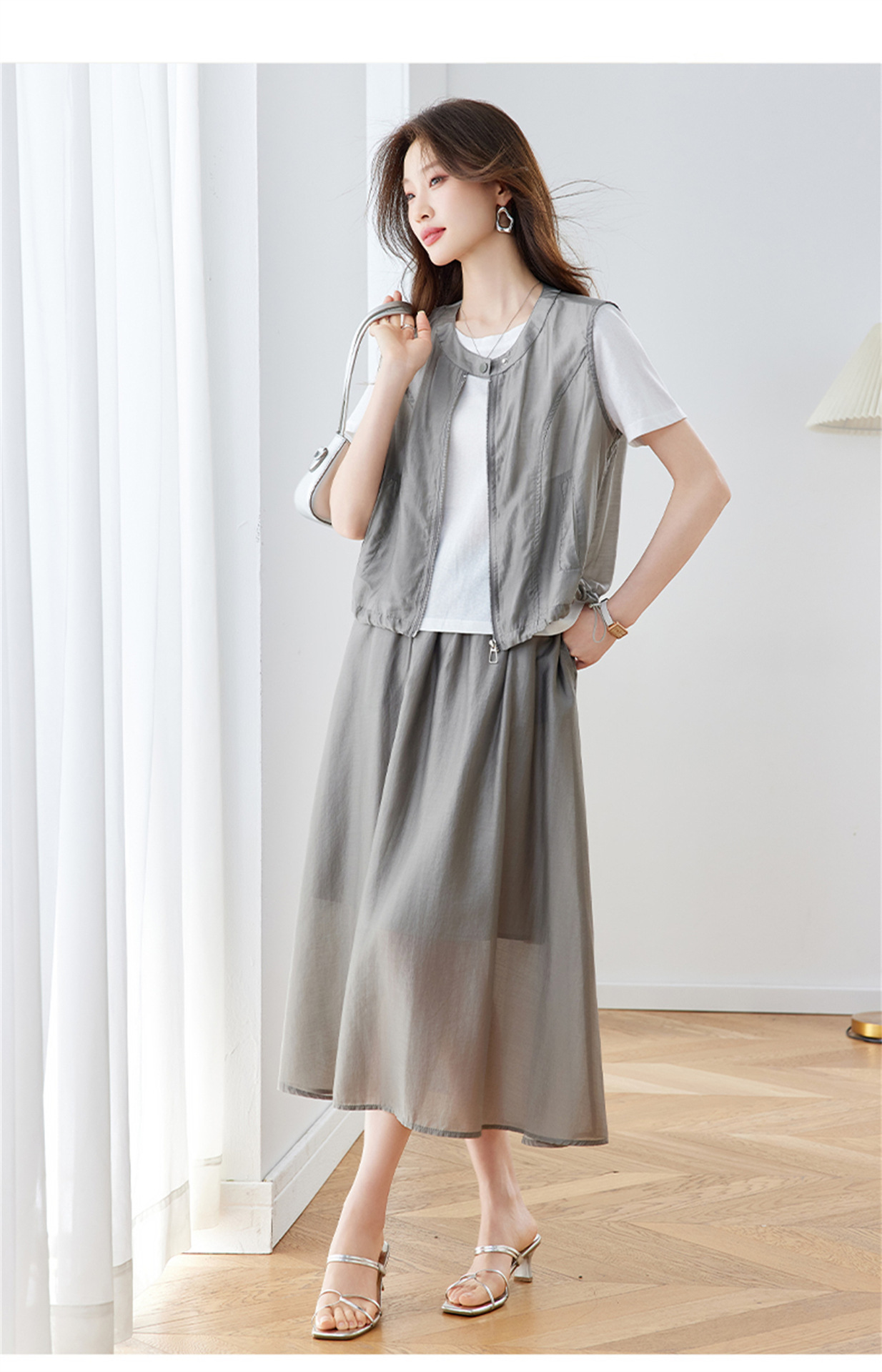 Bộ ba món thời trang nữ hè 2026 gồm áo len vest không tay và chân váy midi — màu đen, màu xám, màu kaki chi tiết 16