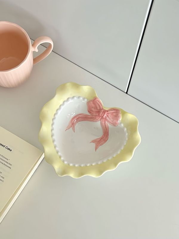 かわいい波の辺の蝶結びの愛の陶磁器のレースの食器の少女の心の家庭の茶碗の皿のドーパミンの食器|undefined