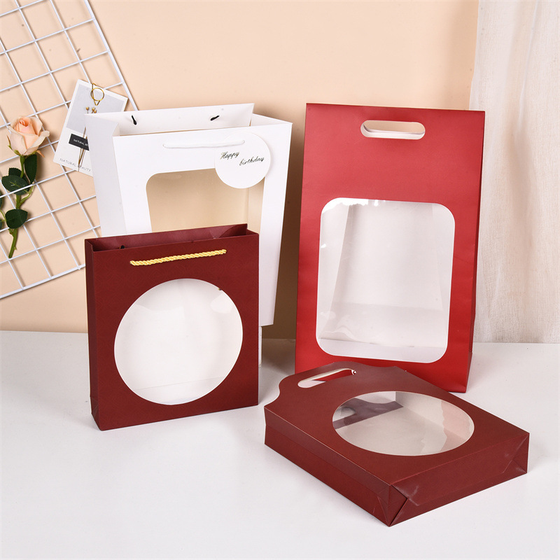 Fabricantes de Tarjeta blanca bolsa de regalo de la ventana bolsa de regalo personalizado papel embalaje bolsa impresión logo venta al por mayor