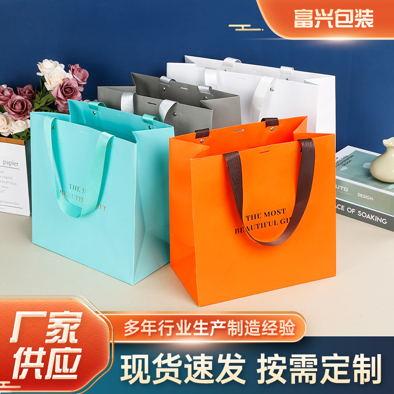 白卡纸袋手提袋批发服装店购物袋现货印字logo白牛皮礼品袋定 制