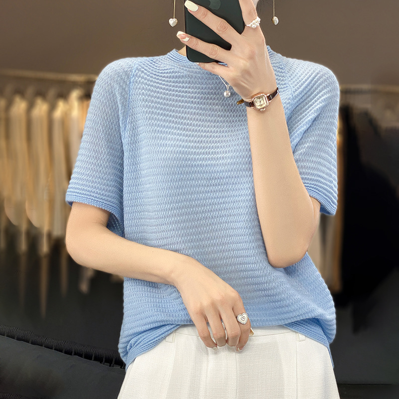 Summer woolen sweater with a round collar